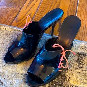 Gucci glossy black heels with pink laces.